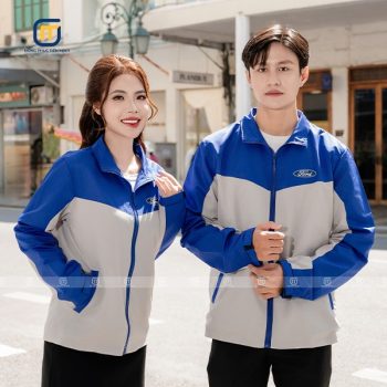 Đồng phục áo gió màu xanh bích và ghi sáng
