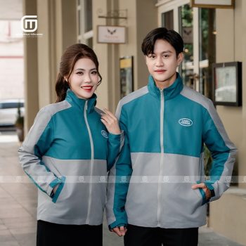 Đồng phục áo gió màu lông công và ghi đậm